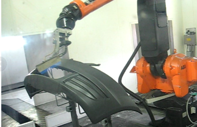 Robotisation d'une ligne de production peinture bouclier et flammage